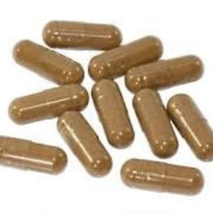 May include: A group of brown capsules, likely a dietary supplement or herbal remedy.