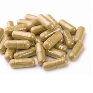 May include: A pile of light brown capsules, likely herbal supplements.