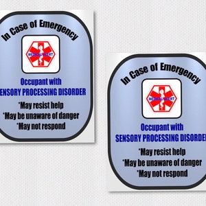 May include: Two blue and white stickers with the text "In Case of Emergency" and a red medical alert symbol. The text below the symbol reads "Occupant with SENSORY PROCESSING DISORDER *May resist help *May be unaware of danger *May not respond"