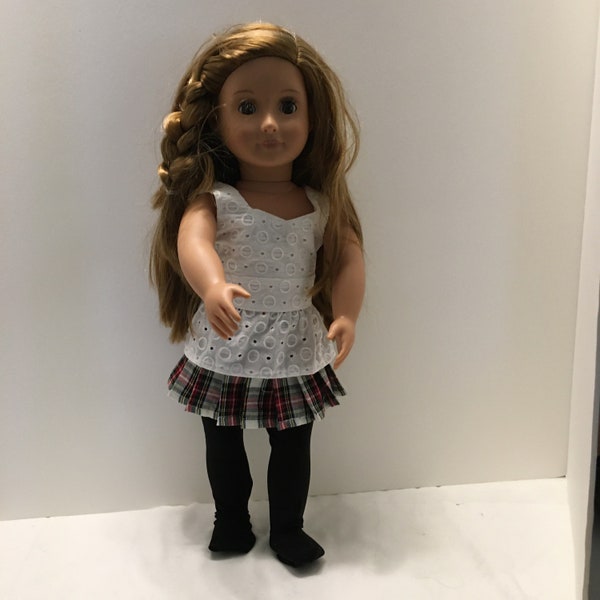 DO40- 18" Doll Outfit: three piece outfit with a white peplum top, red and black plaid pleated skirt, and black tights.