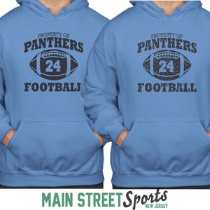 May include: Two blue hooded sweatshirts with the text "Property of Panthers Football" and a football with the number 24 on it.