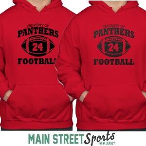 May include: Red hooded sweatshirt with black text that reads "Property of Panthers Football" and a black and white football graphic with the number 24.
