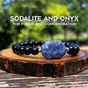 May include: A bracelet with black onyx beads and a blue sodalite stone. The bracelet is displayed on a wooden slice. Text reads "SODALITE AND ONYX FOR FOCUS AND CONCENTRATION". The background is a blurred outdoor scene.