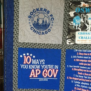 May include: A blue and white quilt with various patches. One patch features a soccer ball with the text "Sockers FC Chicago" and another patch features the text "10 Ways You Know You're in AP Gov 2013-2014".