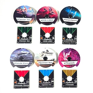 May include: Nine game tokens with various designs and names, including "Carnor Jax," "DIS-L9B2," and "Tamara Ryvora." The tokens are circular and square, featuring images of spaceships and characters. The color palette includes red, blue, and green.
