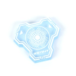 May include: A light blue hexagonal shaped plastic token with a white circular design in the center and the word "JETWURF" written in white at the bottom.