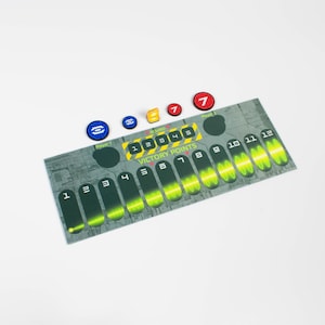 May include: A green and grey game board with a green and yellow victory point tracker. The board has numbers 1 through 12 on it. There are also four small blue and red tokens on the board.
