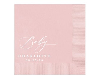 May include: Pink paper napkins with white text that reads "Baby Charlotte 06.25.24".