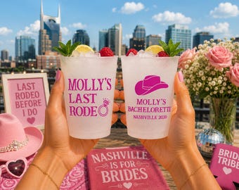 May include: Two frosted plastic cups filled with ice, lemon, raspberries, and mint. The left cup features pink text reading MOLLY'S LAST RODEO with a ring icon. The right cup features a pink cowboy hat icon and text reading MOLLY'S BACHELORETTE NASHVILLE 2030.