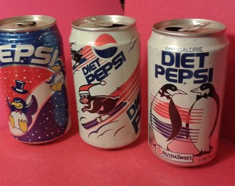 Vintage Pepsi and Diet Pepsi soda cans with penguins