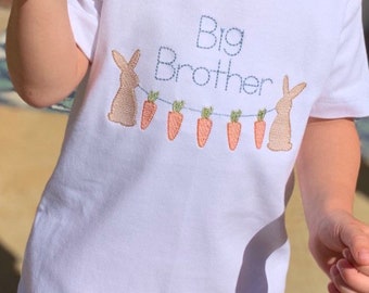 May include: White t-shirt with embroidered bunnies and carrots, and the text "Big Brother" in blue thread.