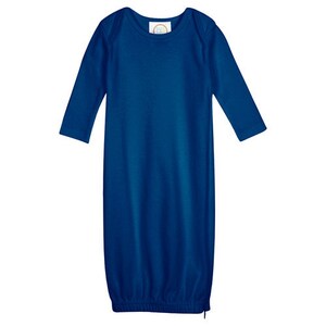 May include: A royal blue long-sleeved gown for a baby. The gown has a round neckline and a gathered bottom.