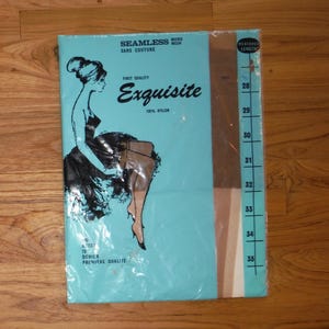 May include: A package of "Exquisite" nylon stockings. The package is light blue with a drawing of a woman wearing a dress and stockings. The package has a measurement guide on the side, and the text "SEAMLESS SANS COUTURE" is at the top.