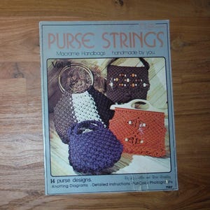 May include: A book cover titled "PURSE STRINGS" featuring macrame handbag designs. The cover displays various handmade purses in brown, white, purple, and orange. Text includes "14 purse designs" and "Knotting Diagrams".