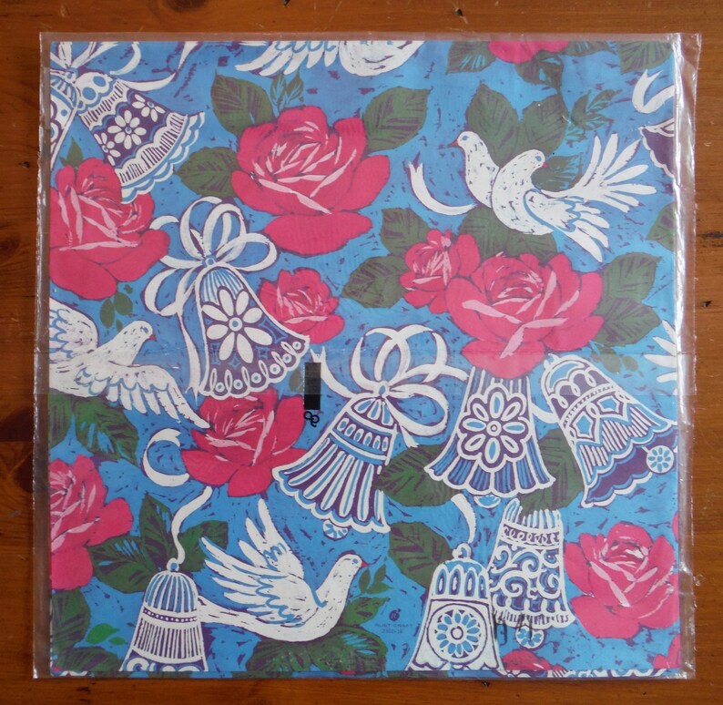 May include: Blue wrapping paper with a repeating pattern of white doves, pink roses, and blue bells with white ribbons.