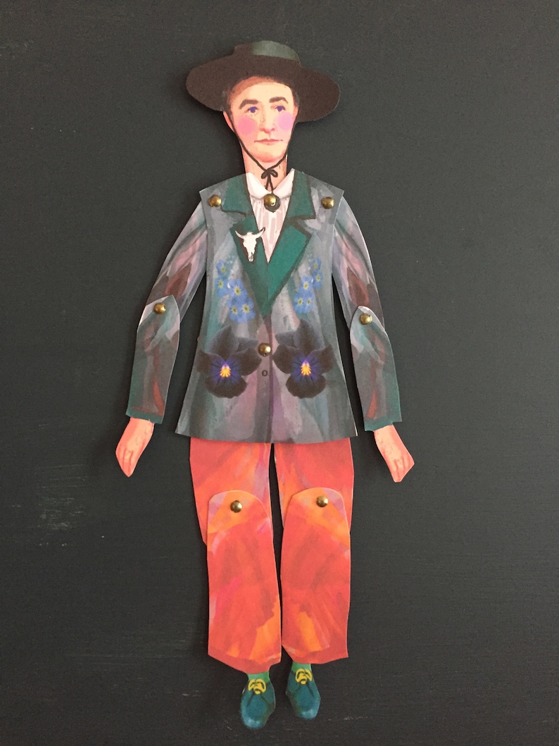 May include: A paper doll with a black hat, green and gray jacket with floral accents, orange pants, and blue shoes.