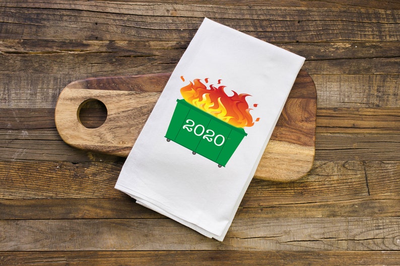 Dumpster Fire 2020 Gift Printed Flour Sack towel can be purchased here: https://www.etsy.com/listing/576322063/dumpster-fire-2020-gift-printed-flour?ref=cart