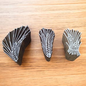 A  wheat hemp pottery stamp ceramic mould scrapbooking tjap batik printing floral carved stamps.