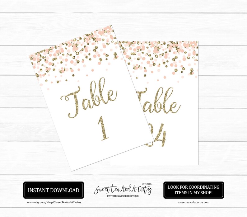 May include: Two printable table number cards with a pink and gold confetti design. The text "Table" and the table numbers "1" and "24" are in gold glitter font.