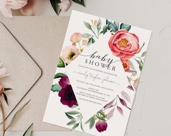 May include: A baby shower invitation with a floral design. The invitation features pink and burgundy flowers, green leaves, and the words "baby shower". The invitation also includes the name "emily taylor johnson" and event details.