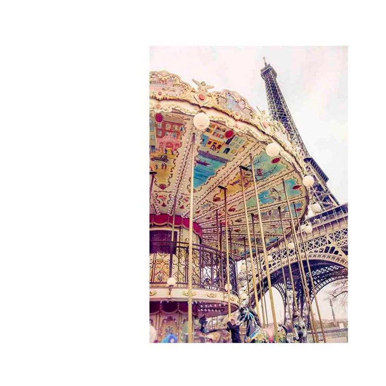 May include: A vintage carousel with colorful painted details and a white roof, set against the backdrop of the Eiffel Tower in Paris, France.