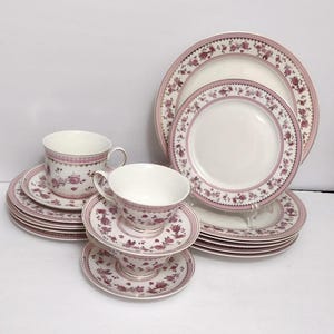 May include: A set of three ceramic mugs with a speckled, matte finish. The mugs are in shades of cream, light gray, and dark gray. Each mug has a simple, minimalist design, perfect for coffee or tea.