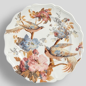 May include: White ceramic serving platter with a scalloped edge. The platter features a detailed illustration of two birds perched on branches with pink, blue, and brown flowers. The design has a vintage, botanical theme.