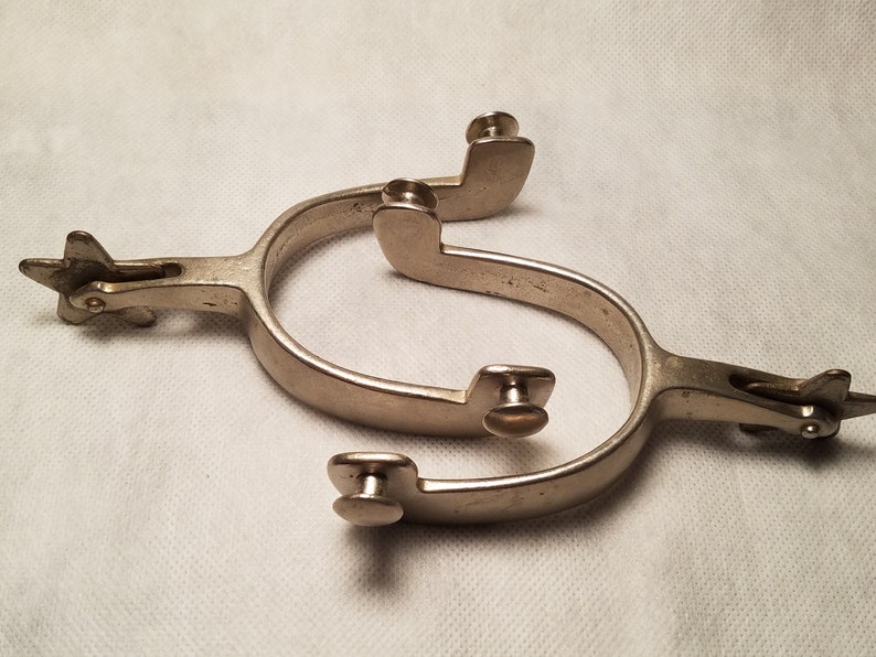 Pair of Marked North and Judd Spurs with 5 Point Star Rowels with Straps