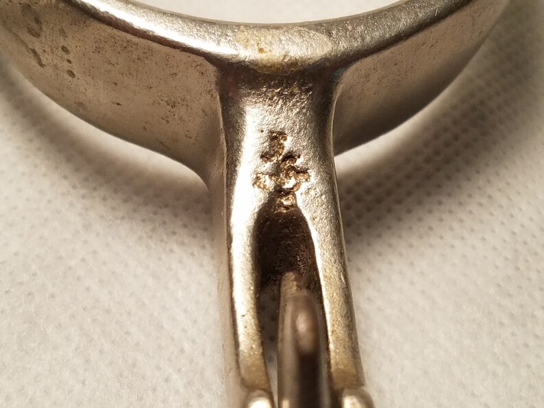 Pair of Marked North and Judd Spurs with 5 Point Star Rowels with Straps