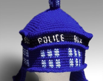May include: Blue crocheted hat shaped like a police box with the text "POLICE BOX" on the front.