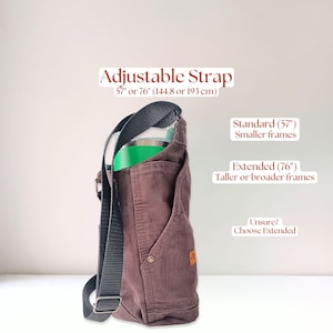 Side seam view of a Carhartt chocolate brown water bottle bag made from rugged 12 oz Carhartt duck canvas pants. The text on the picture reads, "Adjustable Strap 57 inches or 76 inches (144.8 or 193 cm). Standard 57" for smaller frames; Extended 76" for taller or broader frames; Unsure? Choose Extended."