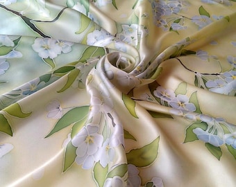 Floral silk scarf handpainted cherry blossoms on a soft green-yellow background is a beautiful gift for a woman.