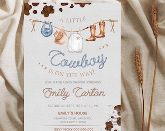 May include: A baby shower invitation with a blue and brown cowboy theme. The invitation features a line of baby clothes hanging on a rope with a cowboy boot, bib, hat, and overalls. The text reads "A Little Cowboy Is On The Way!" and includes the baby shower date, time, and location.