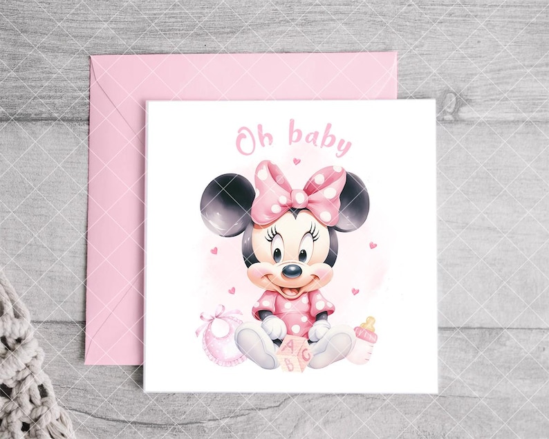 K&ouml;nnte beinhalten: Rosa Babyparty-Gru&szlig;karte mit Minnie Maus in einem rosa gepunkteten Kleid und Schleife. Auf der Karte steht "Oh baby" in rosa Schrift. Ein rosa Umschlag befindet sich hinter der Karte.