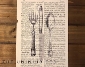 May include: A vintage dictionary page featuring a black ink illustration of a three-pronged fork and a spoon overlaid on columns of text. The page includes definitions for words ranging from dill to dineric, with the text THE UNINHIBITED printed at the bottom.