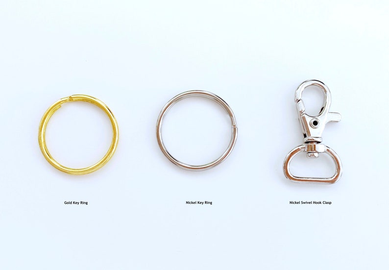 May include: Three keychains: a gold key ring, a nickel key ring, and a nickel swivel hook clasp.