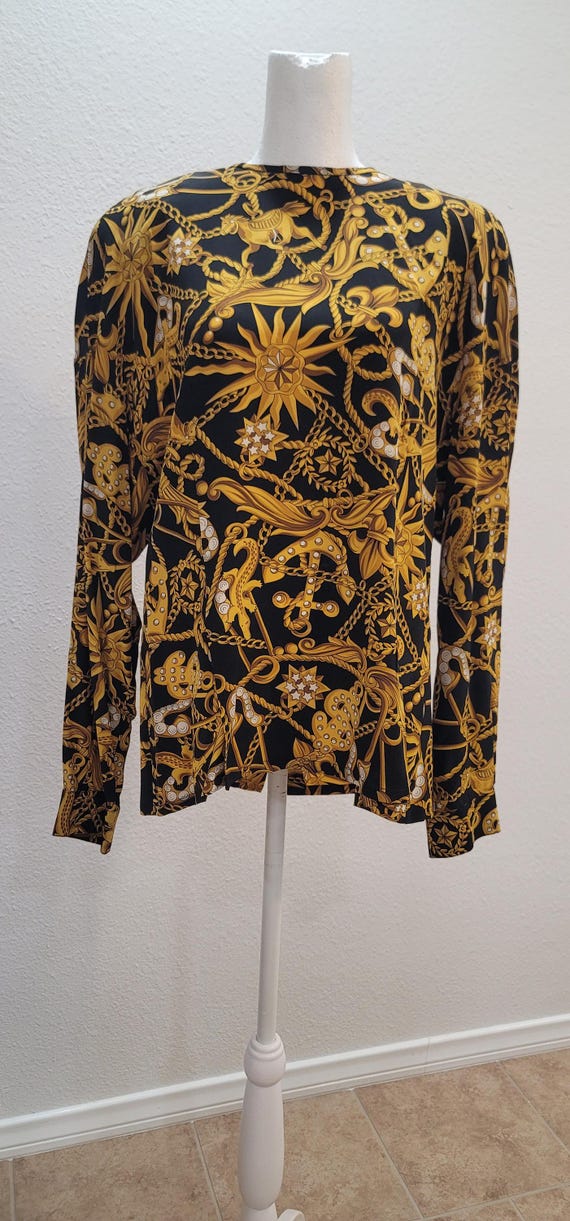 Fun blouse that buttons up in the back. - image 1