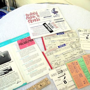 May include: Vintage travel ephemera including airline tickets, boarding passes, and brochures. The brochures advertise "fiestaval flights to Florida" and include a Miami destination tag. Other tickets are marked "Philadelphia".