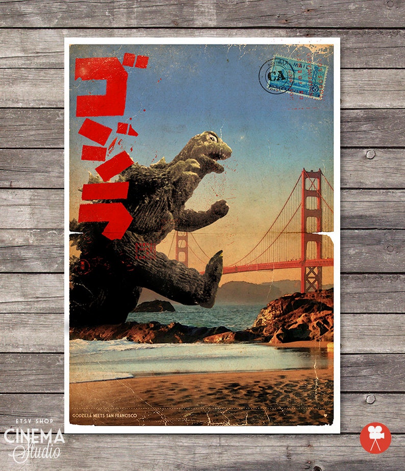 May include: A vintage-style poster featuring Godzilla standing on a beach in front of the Golden Gate Bridge. The poster has a red Japanese text that says "Godzilla" and the words "Godzilla Meets San Francisco" at the bottom.
