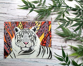 White tiger magnet on orange-yellow background