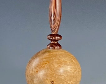 Hollow form turned from Maple Burl, with finial of Kingwood Rosewood