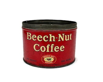 May include: Vintage Beech-Nut Coffee tin. The red tin features the words "Beech-Nut Coffee" in gold lettering. The tin also has a "Beech-Nut Brand" logo and states "Net Weight One Pound". The tin has a black rim.