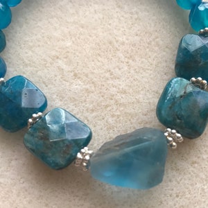 Apatite chunk & square pillow beads sterling silver blue dyed agate stretchy bracelet fits 7-8” wrist. Very easy and comfortable to wear.