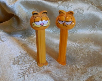 Vintage Garfield Pez Dispenser in Two Different Styles.