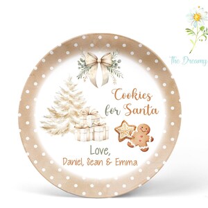 May include: A brown paper plate with white polka dots. The plate has a Christmas tree, presents, a gingerbread man, and a star. The text on the plate reads "Cookies for Santa" and "Love, Daniel, Sean & Emma".