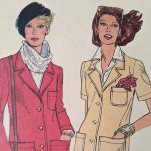 May include: Two women wearing jackets. The woman on the left is wearing a red jacket with a black beret and a plaid skirt. The woman on the right is wearing a beige jacket with a white shirt and blue trousers.