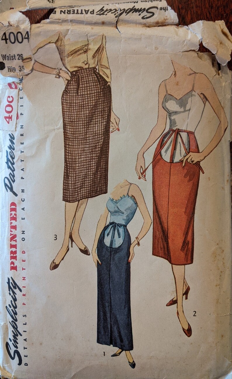 May include: Vintage Simplicity sewing pattern for a skirt. The pattern is printed on paper and shows three different styles of skirts. The pattern number is 4004 and the price is 40 cents.