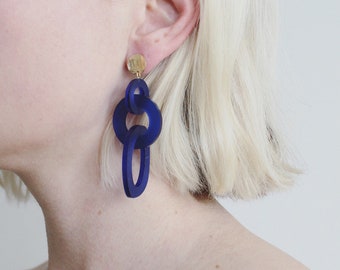 Dello abstract interlocking earrings in blue and gold