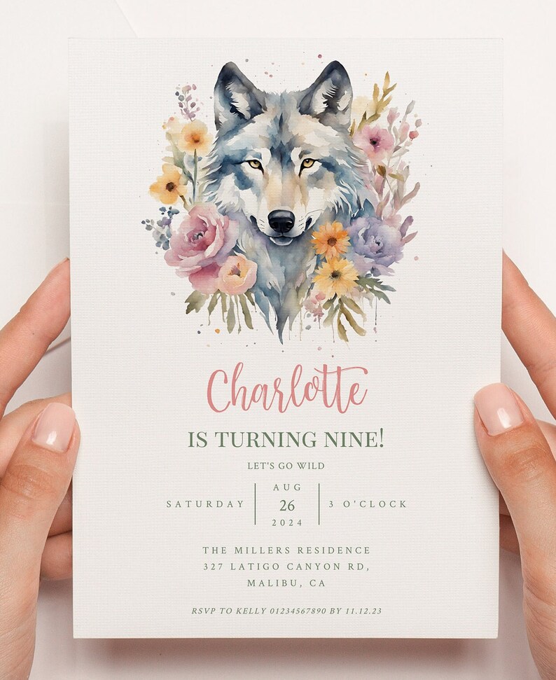 May include: A watercolour illustration of a wolf surrounded by pink, yellow, and purple flowers. The text "Charlotte is turning nine!" is written in pink script. The text "Let's go wild" is written in green. The date "Aug 26, 2024" and time "3 o'clock" are written in black. The text "The Millers Residence 327 Latigo Canyon Rd, Malibu, CA" is written in black. The text "RSVP to Kelly 01234567890 by 11.12.23" is written in black.