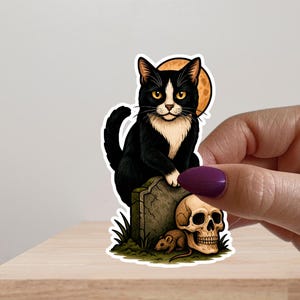 Tuxedo cat with gravestone skull and mouse vinyl sticker decal, cute spooky macabre aesthetic stickers for black and white cat kitten lovers